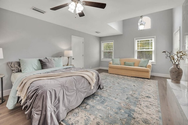 bedroom with ceiling fan and hardwood / wood-style floors