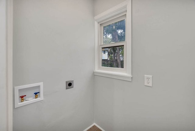 laundry room with hookup for an electric dryer and hookup for a washing machine