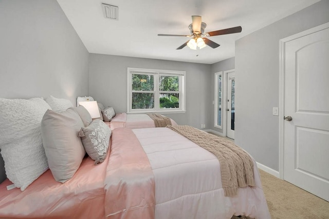 bedroom with ceiling fan and light colored carpet