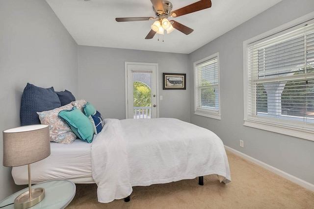 bedroom featuring carpet floors, access to outside, and ceiling fan