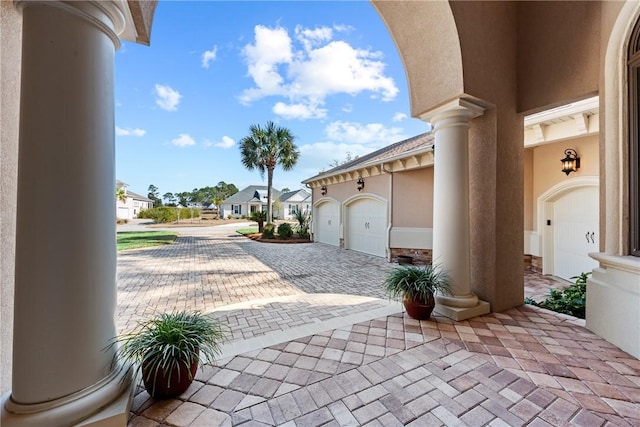 view of patio with a garage