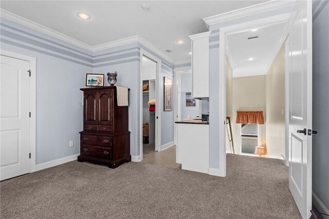 corridor featuring ornamental molding and carpet floors