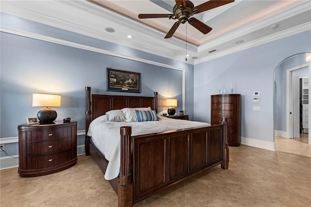 bedroom with crown molding, ceiling fan, a tray ceiling, and light tile patterned floors