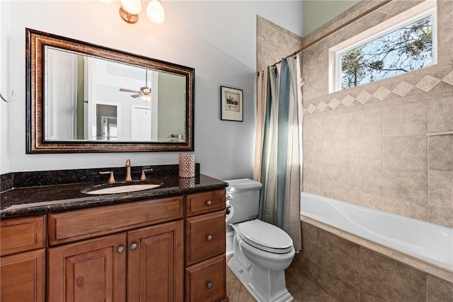 full bathroom with tile patterned flooring, vanity, shower / tub combo, ceiling fan, and toilet