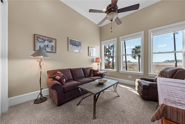 living room with crown molding, plenty of natural light, carpet floors, and ceiling fan