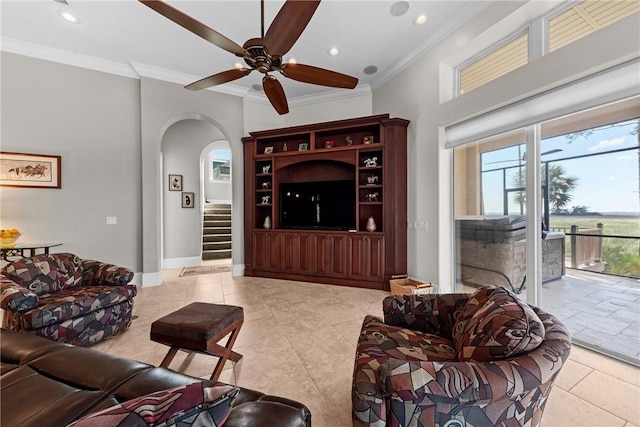 living room featuring ceiling fan and ornamental molding