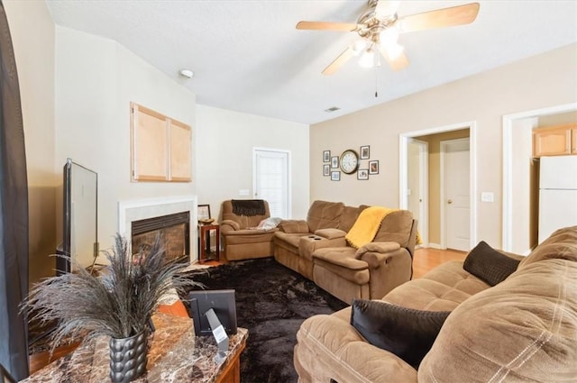 118 Drayton Cir, Brunswick, GA 31525 - living area featuring ceiling fan, a glass covered fireplace, and wood finished floors
