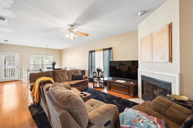 118 Drayton Cir, Brunswick, GA 31525 - living room featuring a ceiling fan, light wood-type flooring, and a fireplace