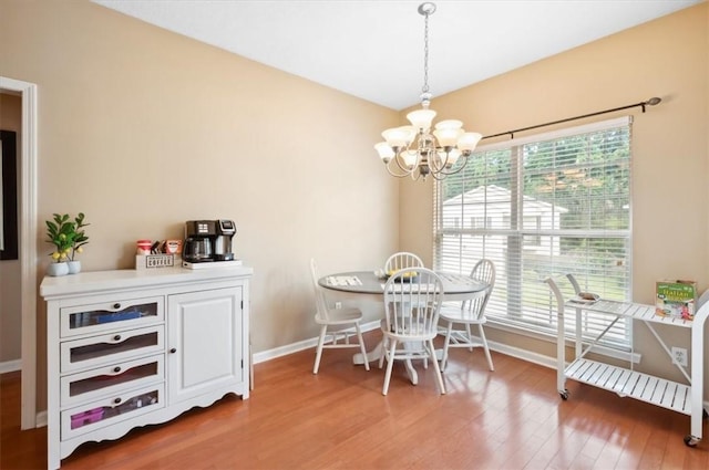 118 Drayton Cir, Brunswick, GA 31525 - dining room with a chandelier and light wood-type flooring