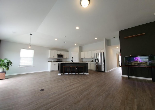 living room featuring recessed lighting, baseboards, lofted ceiling, and dark wood-type flooring