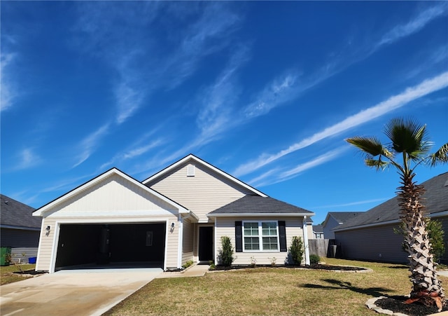 ranch-style home with driveway, a front yard, and an attached garage