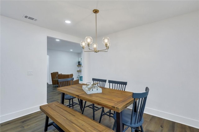 dining space featuring dark hardwood / wood-style floors