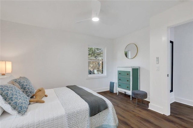 bedroom featuring dark hardwood / wood-style floors and ceiling fan