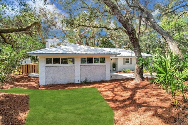 view of outbuilding with a lawn