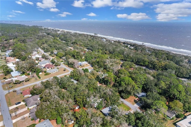 drone / aerial view featuring a water view and a beach view