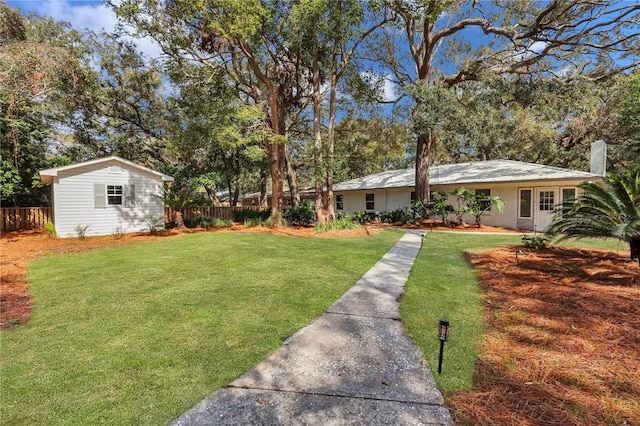 view of yard with an outdoor structure