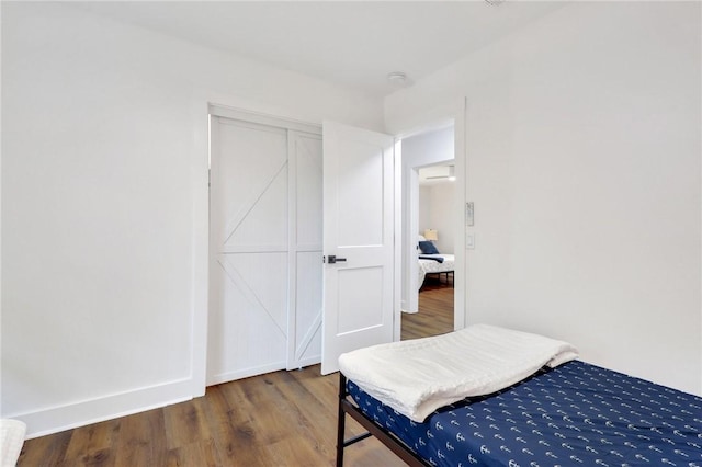 bedroom with hardwood / wood-style floors