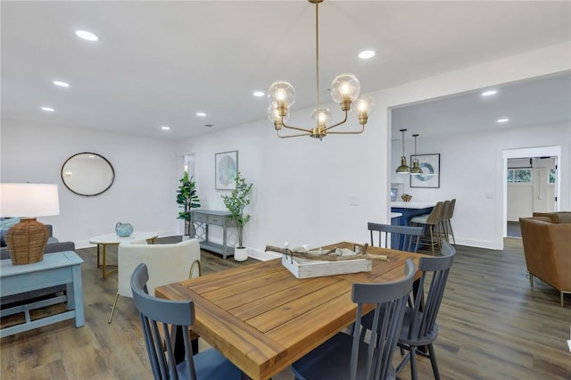 dining space with dark hardwood / wood-style floors