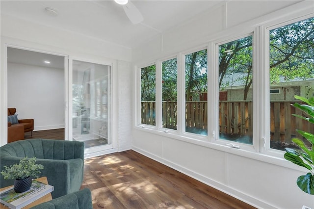 sunroom / solarium with ceiling fan