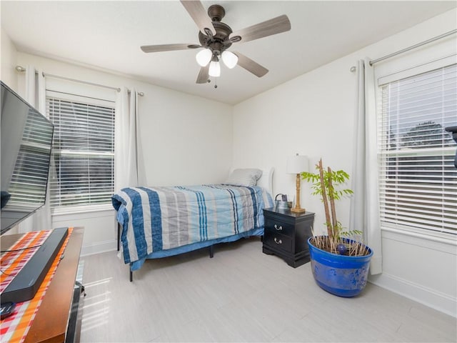 bedroom featuring ceiling fan and baseboards