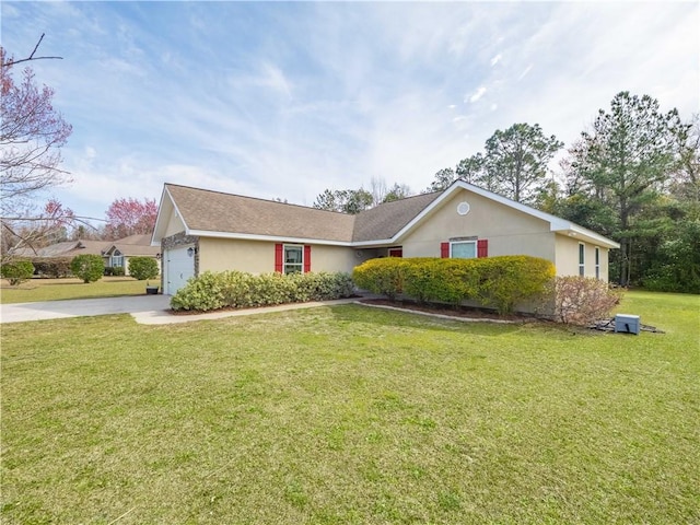 ranch-style home featuring a garage, concrete driveway, a front lawn, and stucco siding