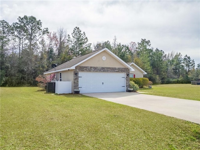 view of front of home featuring driveway, stone siding, stucco siding, and a front yard