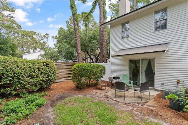 fenced backyard with a patio and cooling unit