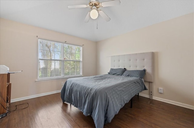 bedroom featuring ceiling fan and dark hardwood / wood-style flooring