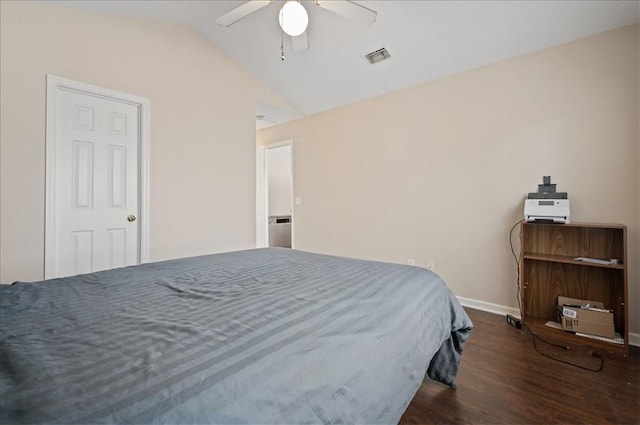 bedroom featuring ceiling fan, dark wood-type flooring, and vaulted ceiling