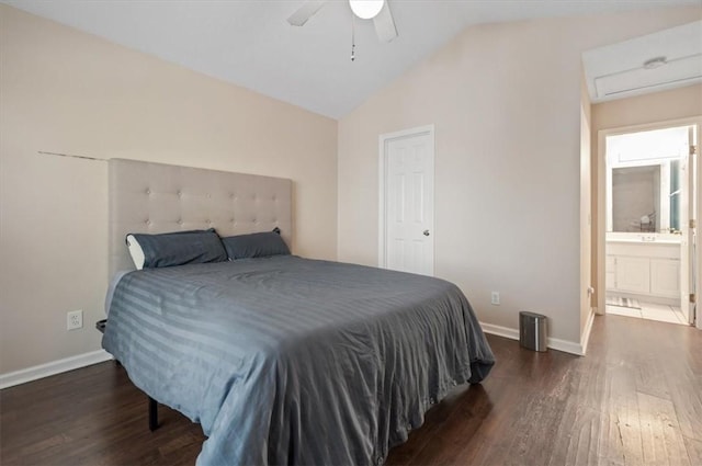 bedroom with lofted ceiling, ceiling fan, dark wood-type flooring, and connected bathroom