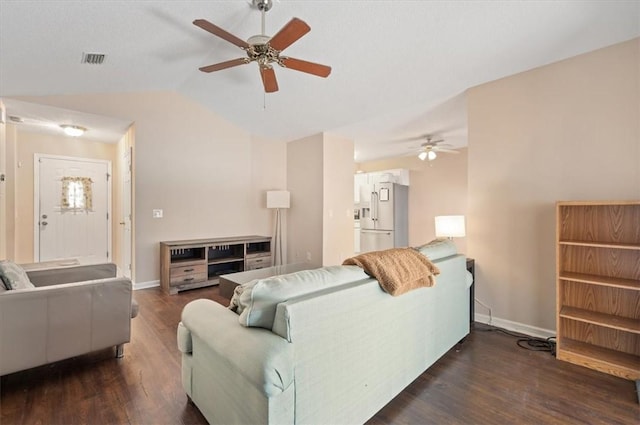 living room with ceiling fan, dark wood-type flooring, and lofted ceiling