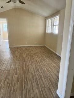 2419 Wolfe St, Brunswick, GA 31520 - unfurnished room featuring baseboards, a ceiling fan, wood finished floors, and vaulted ceiling
