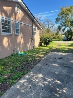 view of side of home with crawl space