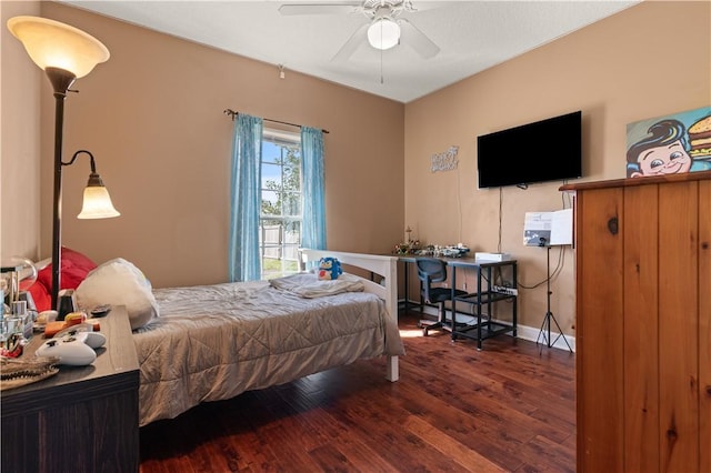 bedroom featuring baseboards and wood finished floors