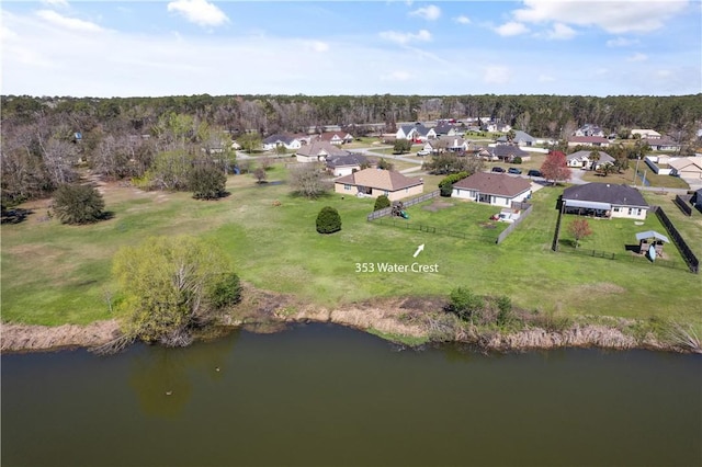 bird's eye view with a residential view and a water view