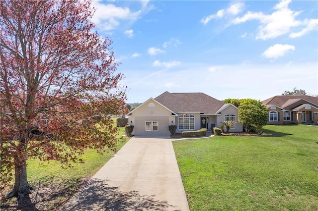 view of front of home with driveway and a front lawn