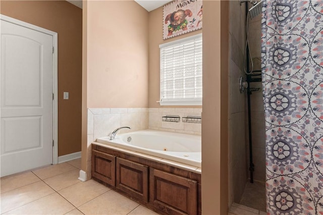 bathroom featuring tile patterned flooring, a garden tub, and a shower with curtain