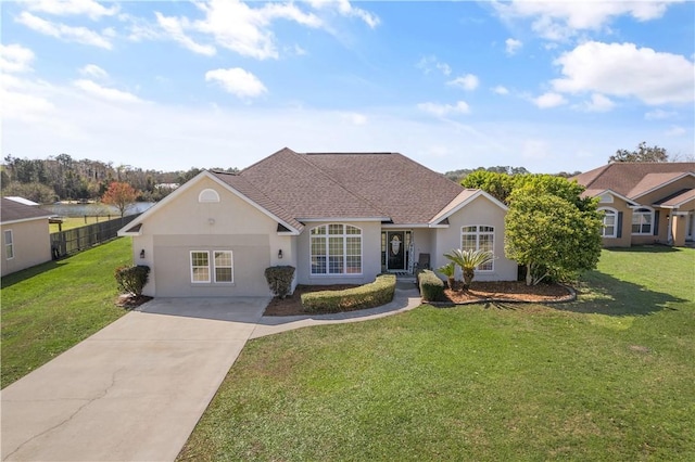 ranch-style home featuring stucco siding, a front lawn, and fence