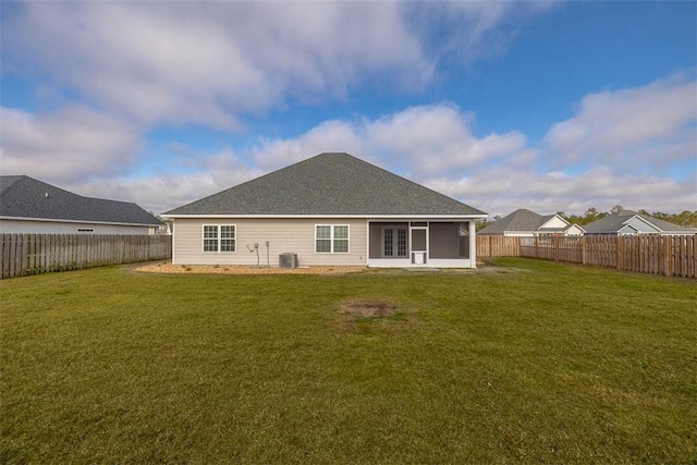 back of house featuring a yard