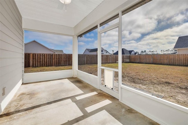 sunroom featuring ceiling fan