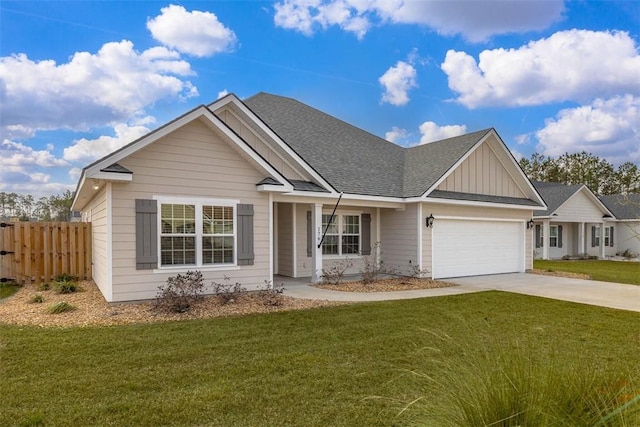 view of front of property featuring a garage and a front yard