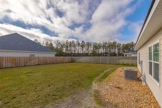 view of yard with central AC