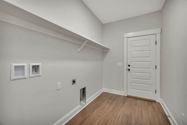 clothes washing area with hookup for a washing machine, electric dryer hookup, and hardwood / wood-style floors