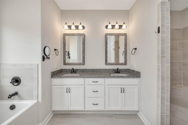 bathroom featuring vanity and tiled shower / bath combo