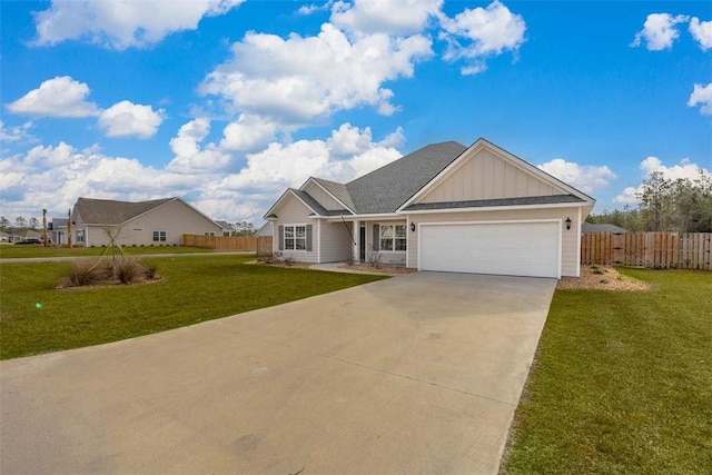 view of front of house featuring a garage and a front lawn