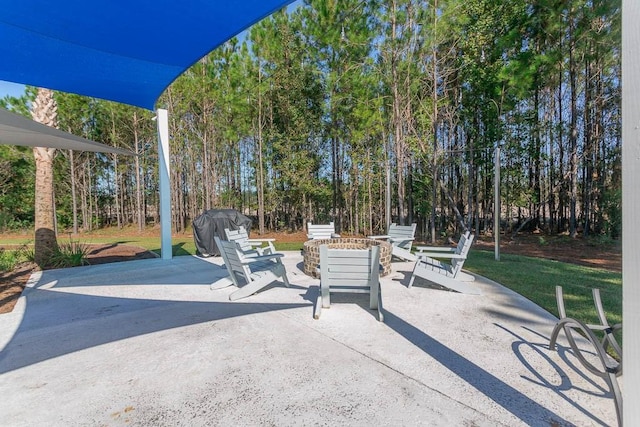 view of patio featuring grilling area and an outdoor fire pit