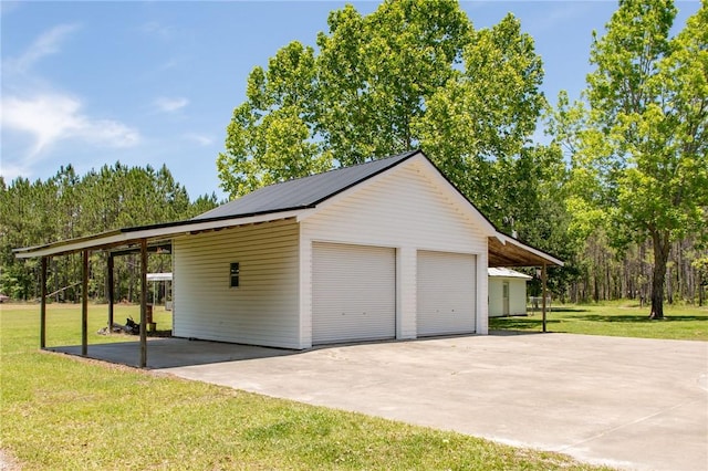 garage featuring a yard