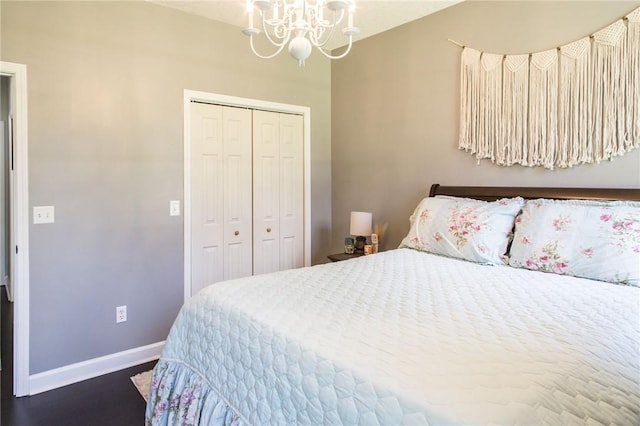 bedroom with a closet and a chandelier