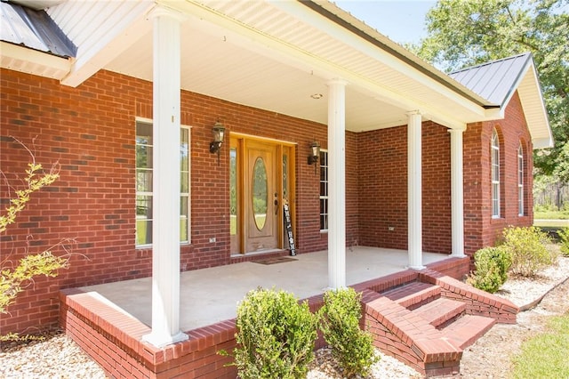 property entrance with covered porch