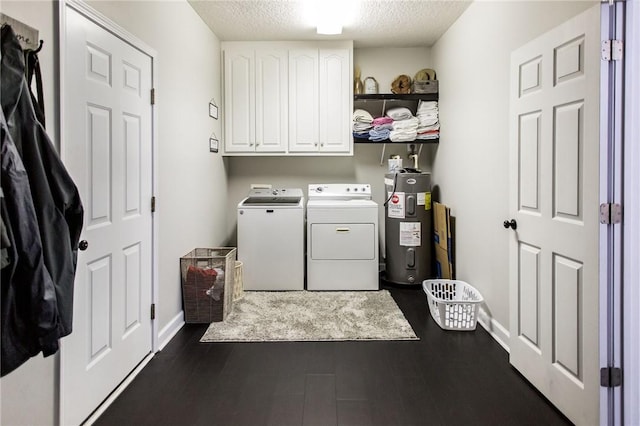 laundry room with dark hardwood / wood-style floors, washer and clothes dryer, water heater, a textured ceiling, and cabinets